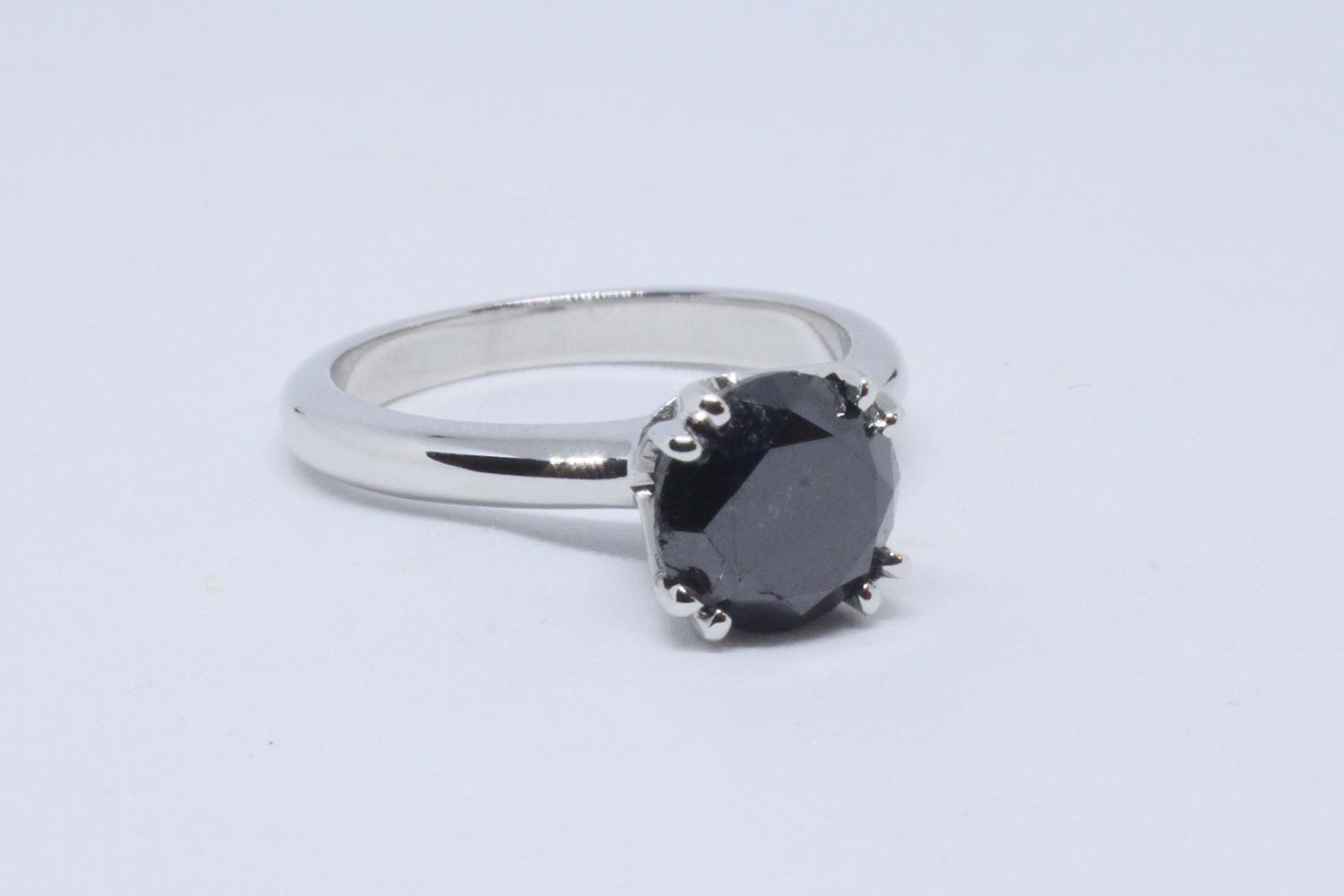 White gold ring with black diamond brilliant cut