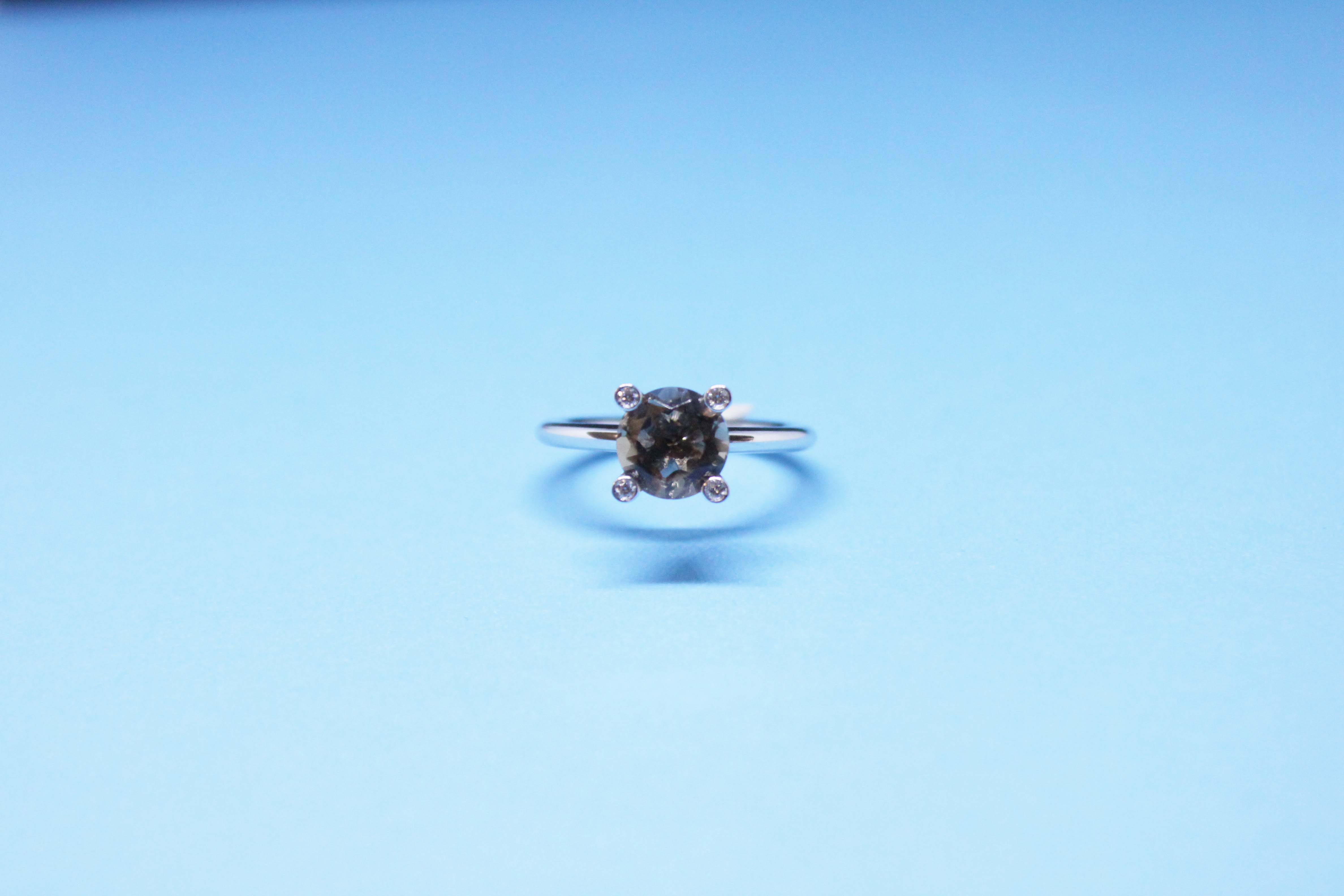 White gold ring with fume quartz and diamonds